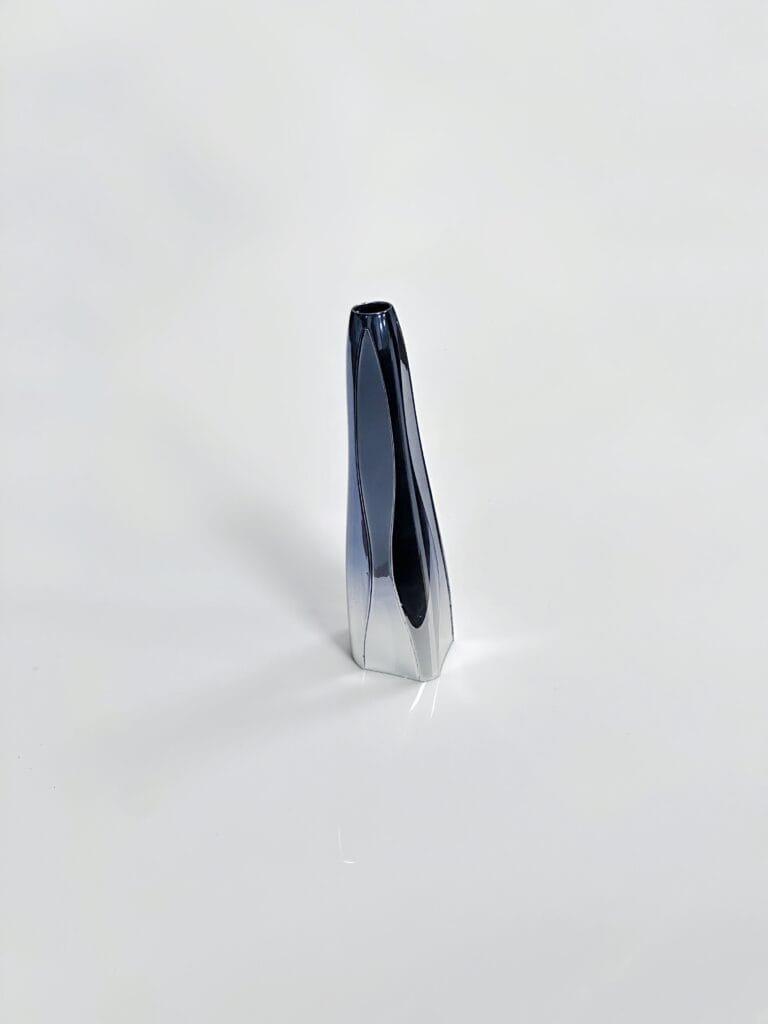 Zinc alloy die-cast beauty device housing with glossy electroplated finish.