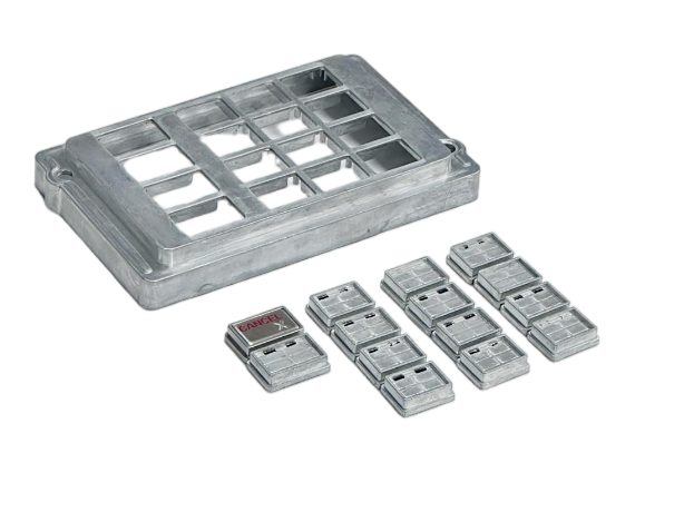 An ATM keypad assembly showing an aluminum die-cast outer frame with individual zinc die-cast buttons that have undergone secondary CNC machining.