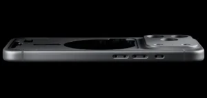 Side profile of an iPhone 17 Pro unibody aluminum shell showing camera island, speaker holes, and precision-machined edges against a black background.