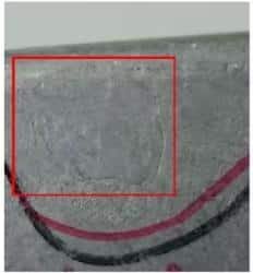 Aluminum die casting surface defect—cold flow (cold lap) highlighted by a red box.
