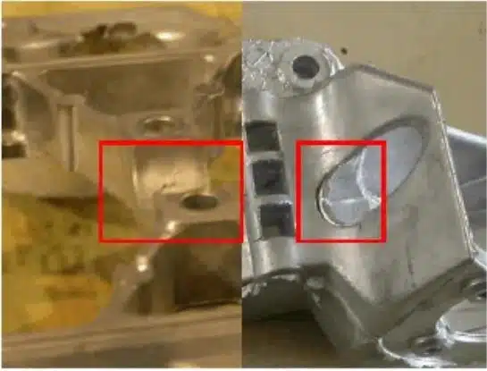 Aluminum die casting lamination/cold-shut (layering) near window feature—overlapped metal skins highlighted.