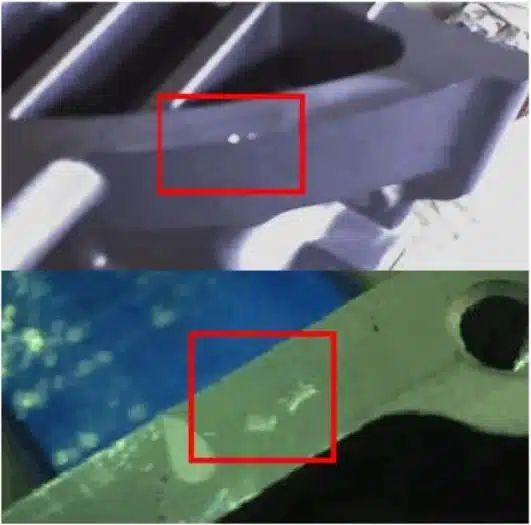 Aluminum die casting inclusion—tiny white specks from trapped dross/oxide on edge surface.