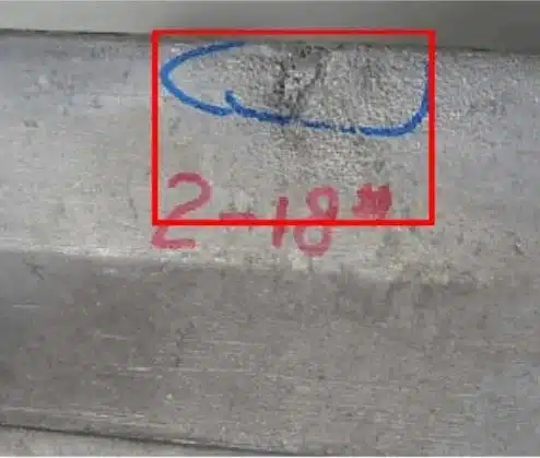 Aluminum die casting soldering/galling—rough matte patch from die pick-up.