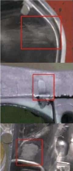 HPDC surface defect—drag marks/scuffing (“strain”) on aluminum die castings, highlighted in red boxes.