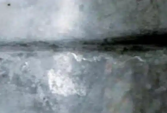 Close-up of a cold shut seam on an aluminum die casting surface