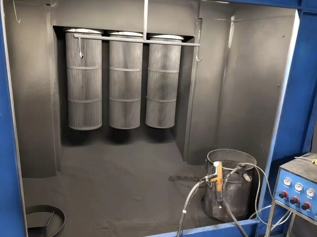Powder Coating Booth for Efficient Industrial Surface Finishing Industrial powder coating booth with cartridge filters, spray gun and powder collection system