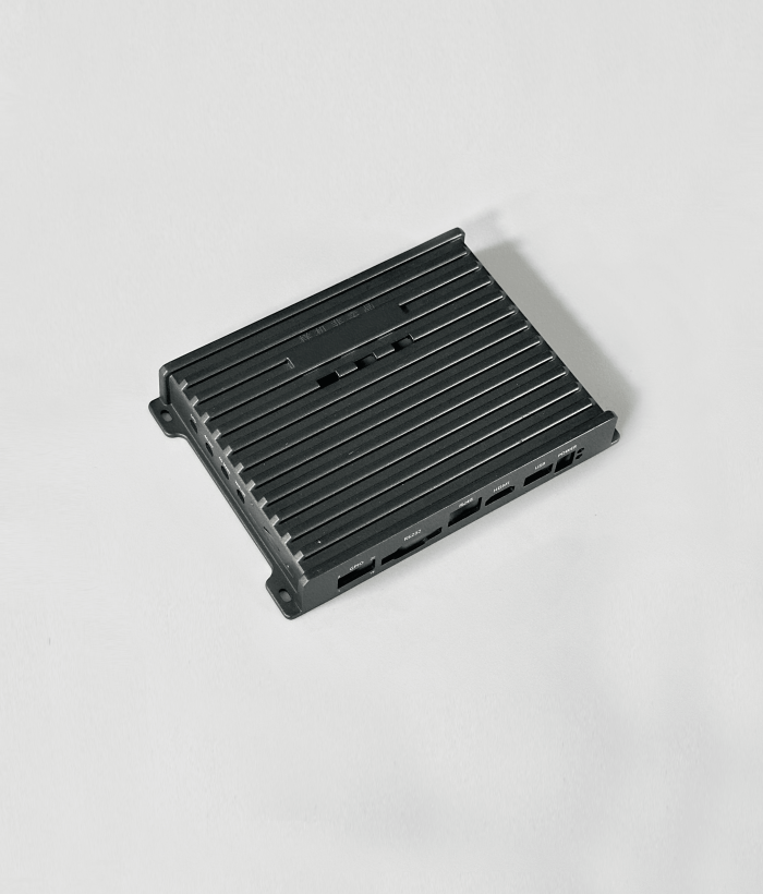 EMI-shielded aluminum die-cast 5G base station enclosure with cooling fins.