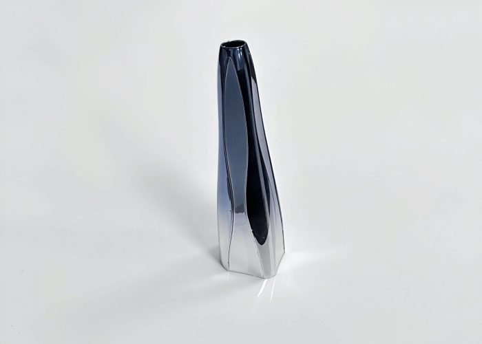 Zinc alloy die-cast beauty device housing with glossy electroplated finish.