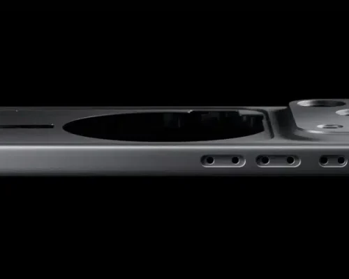 Side profile of an iPhone 17 Pro unibody aluminum shell showing camera island, speaker holes, and precision-machined edges against a black background.