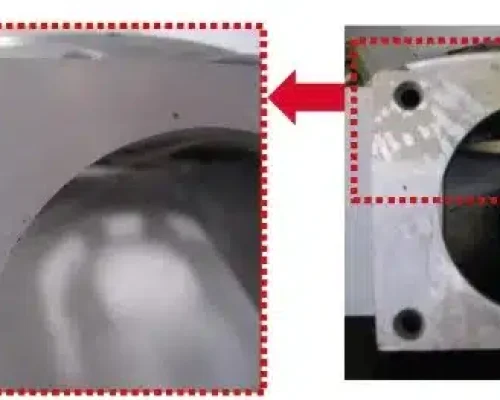 Gas porosity (air pores) on an aluminum die casting, highlighted near the corner